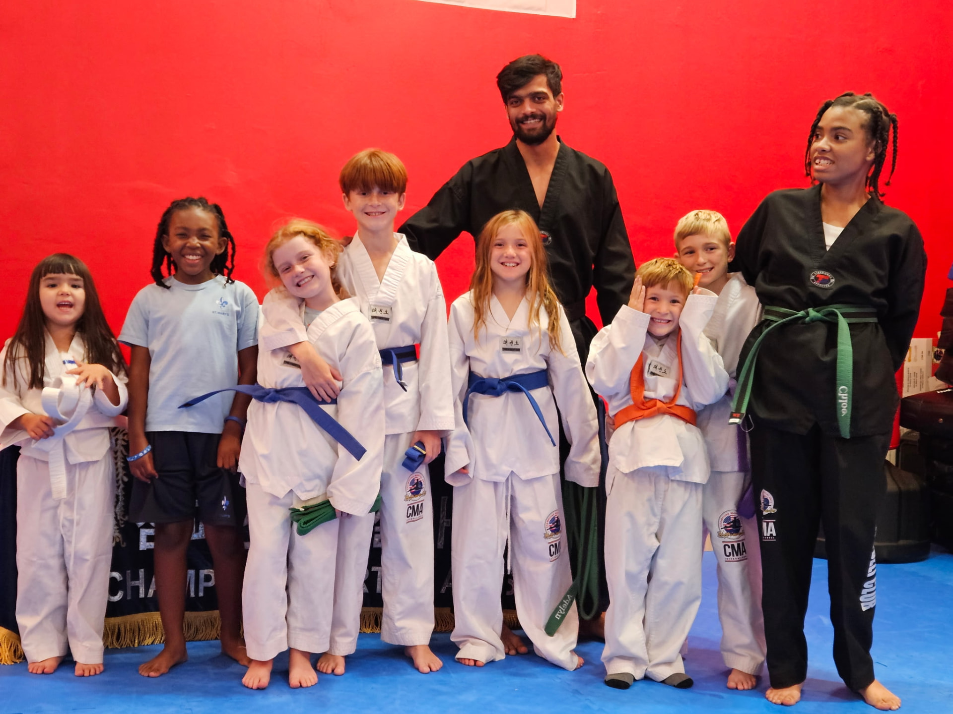 Epic Martial Arts student performing a flying side kick in the dojo